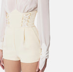 Jumpsuit aus Crêpe und Georgette mit Kreuzschnürmotiv